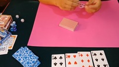 Playing cards catchs card gimmick to uncover secre