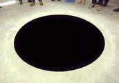 The mysterious black circle in art gallery, one not small drop go down to fall bad!