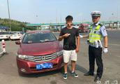 Old city policeman checks driver's license fish t